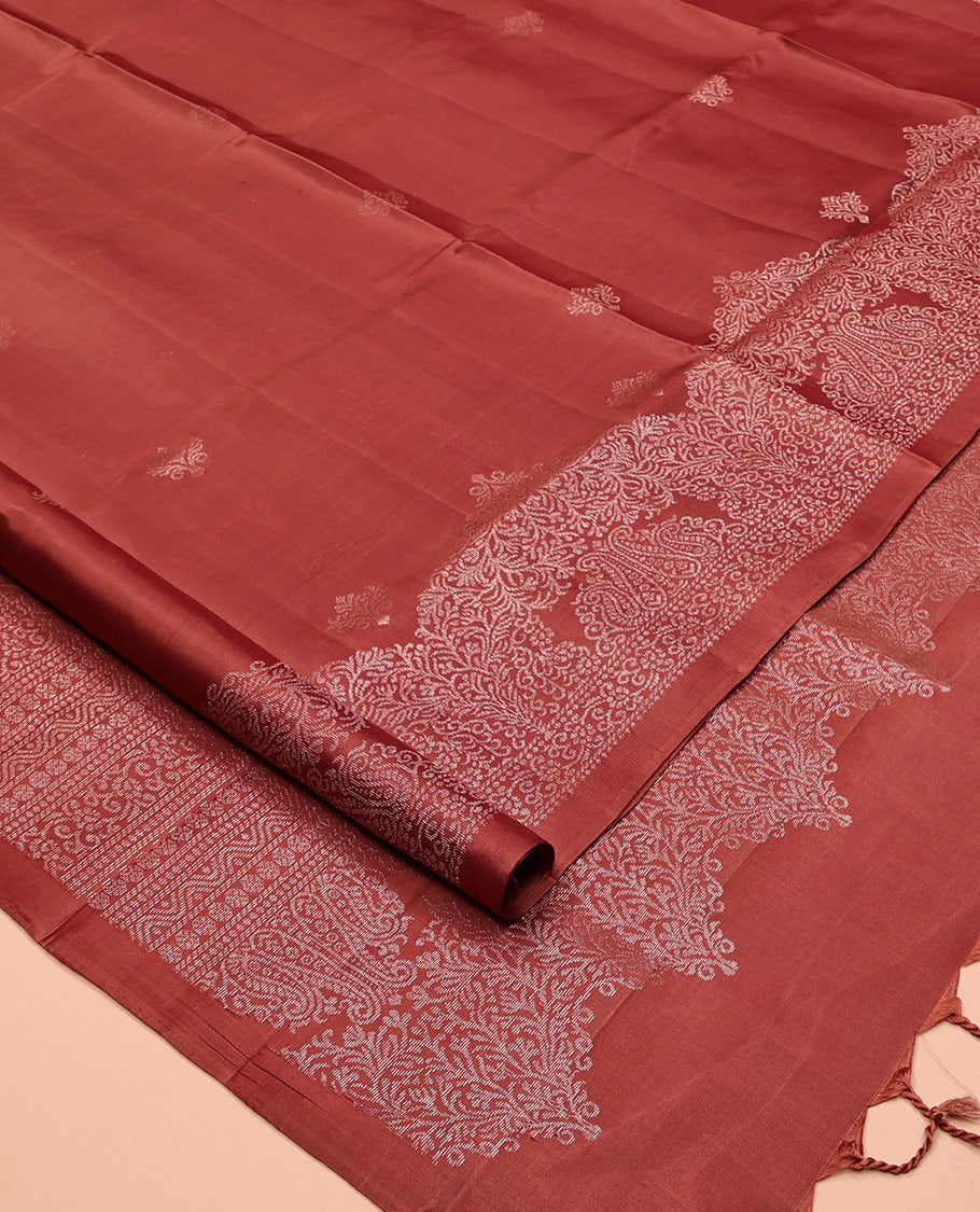 Red Mayuri Soft Silk Saree, Graced with Zari Buttas, a Self-Border, and a Pallu Features an Intricate Weave and a Matching Blouse