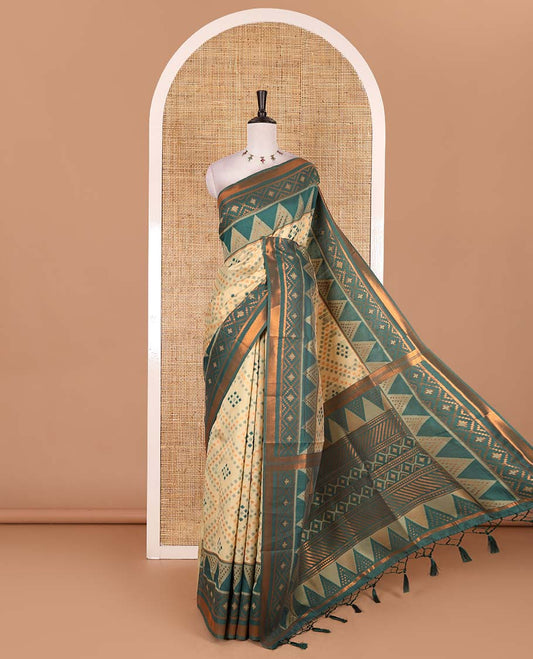Chikku ikkat style zari and thread buttas semi-tussar saree, contrast ikkat design border, geometric patterned pallu, and a contrast blouse