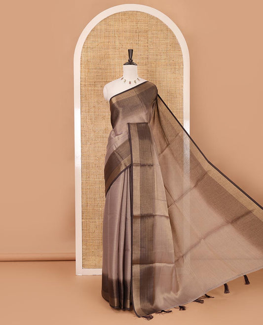Brown plain tissue saree, contrast gold zari piping border & self pallu with tussels