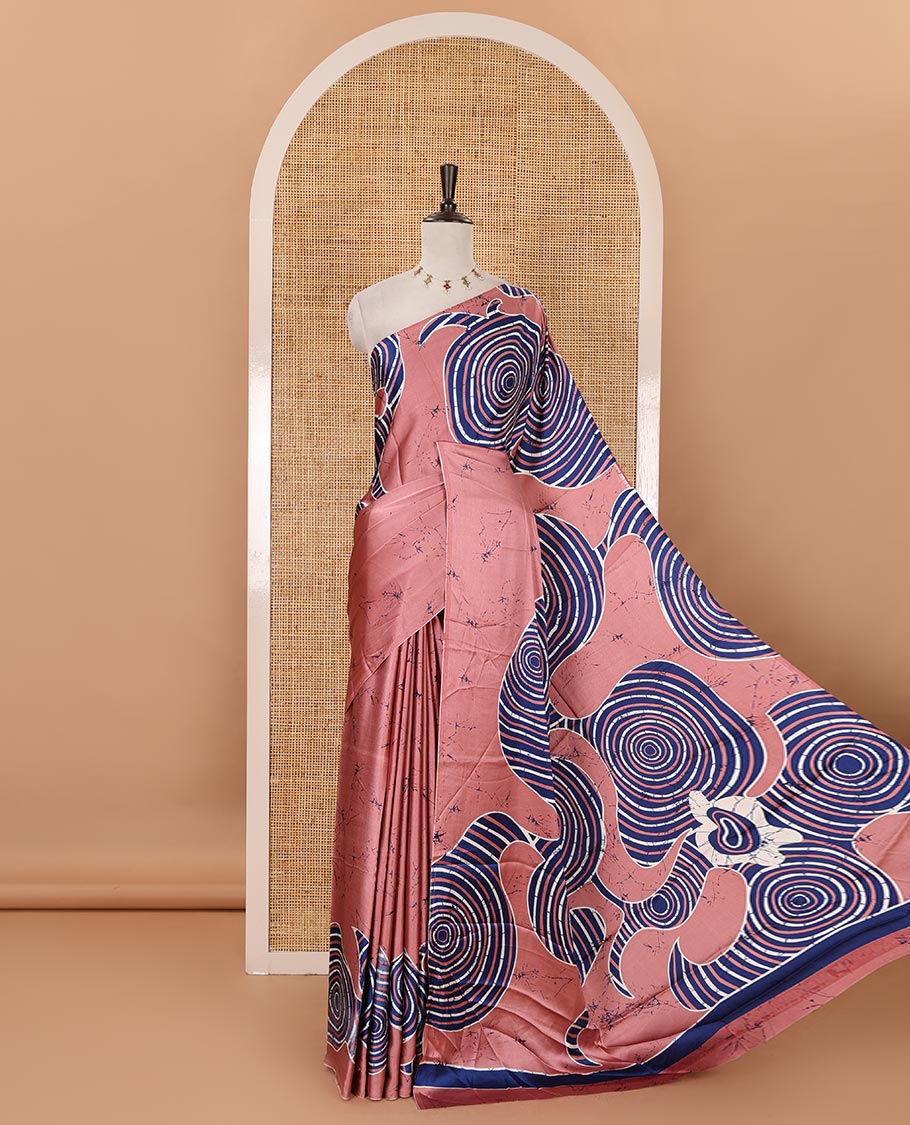 Borderless onion pink batik-style spiral printed satin crepe saree, printed pallu & matching printed blouse