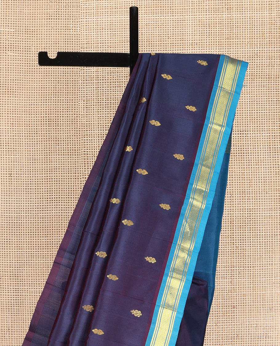 Navy Blue Kanchipuram Silk Saree, Beautifully Bedecked with Zari Buttas on Its Body, Complemented by Contrast One-Sided Border of Banaras, and Jaal Designs, Pallu Features Zari Designs, and Comes Without a Blouse