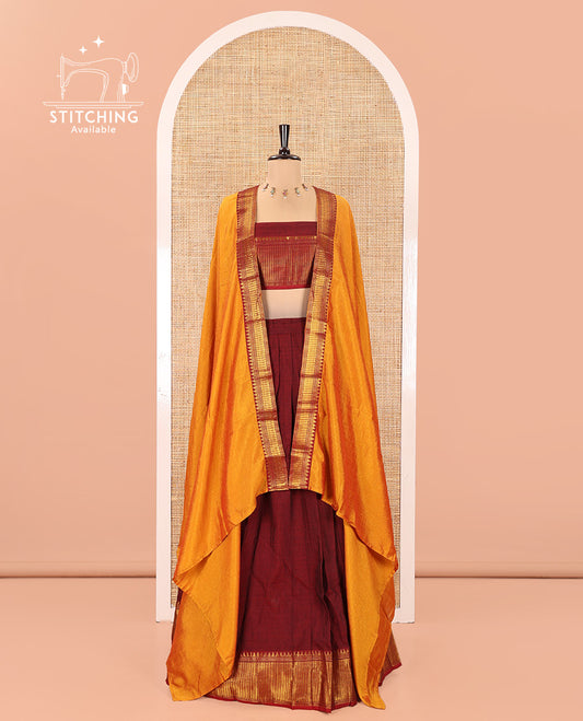 Maroon Mercerised Cotton Half-Saree Features Plain with Contrast Traditional Zari Temple Bordered Skirt, Paired with a Matching Blouse, and Comes with a Contrast Zari-Bordered Dhavani