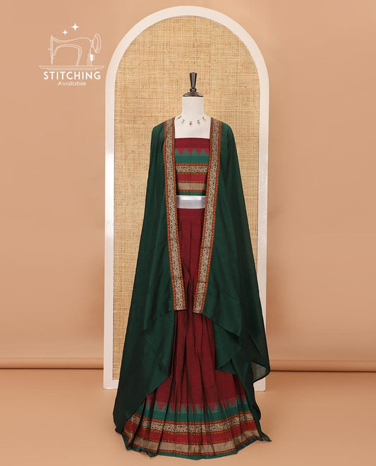 Maroon mercedised cotton half-saree, contrast traditional resham thread border skirt, matching blouse & contrast green thread border georgette dhavani