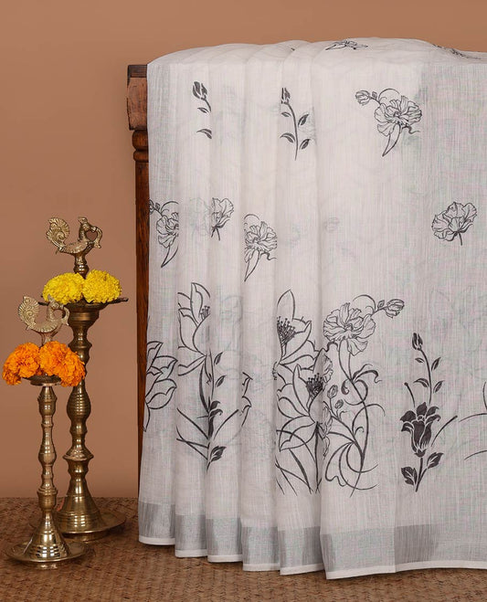 White unique-shaped floral printed linen cotton saree, silver zari border, floral printed pallu & intricate floral print blouse