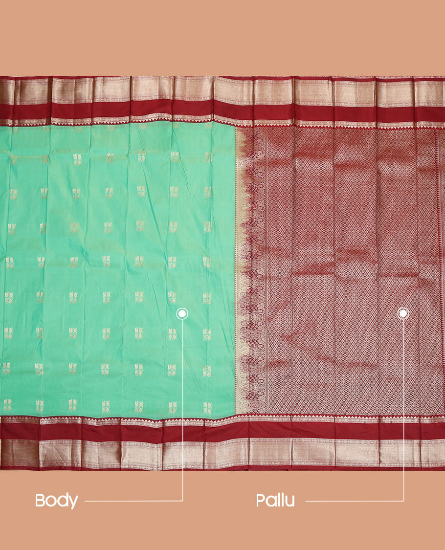 Turquoise Budget Silk Saree, Meticulously Woven with Zari Buttas All Over Its Body, Complemented by a Contrast Traditional Zari Design Woven Rettai Pettu Border, Gleaming Jaal Pallu, and Paired with a Contrast Blouse