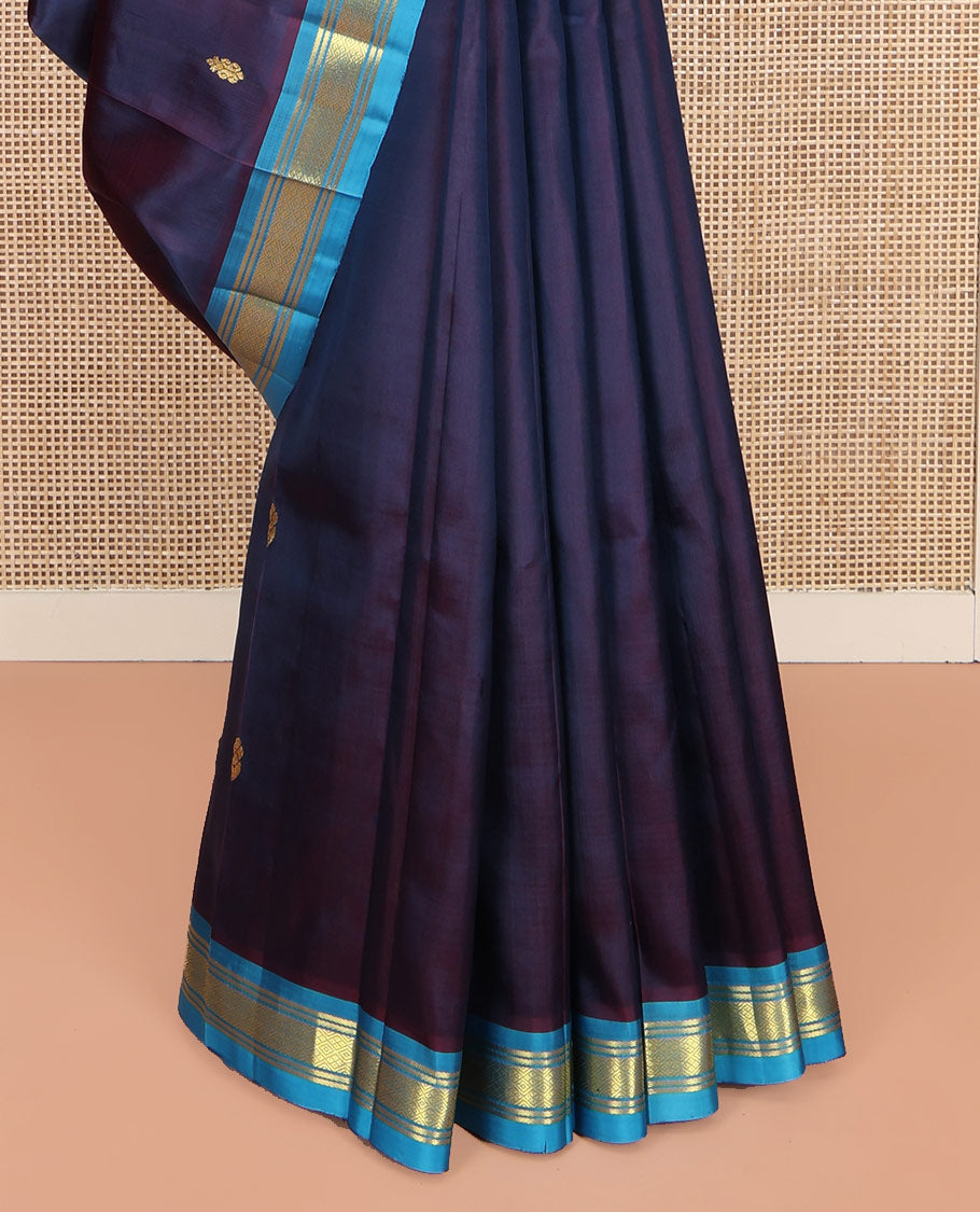 Navy Blue Kanchipuram Silk Saree, Beautifully Bedecked with Zari Buttas on Its Body, Complemented by Contrast One-Sided Border of Banaras, and Jaal Designs, Pallu Features Zari Designs, and Comes Without a Blouse