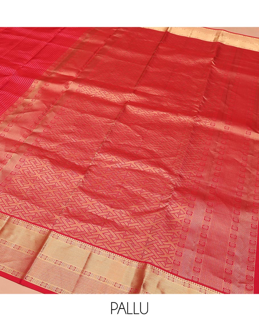 Red Vasundhara Silk Saree, Gleamed Up with Zari Muthu Stripes on Its Body, Highlighted by Zari Border of Traditional Designs, Geometric-Patterned Pallu, and Paired with a Matching Blouse