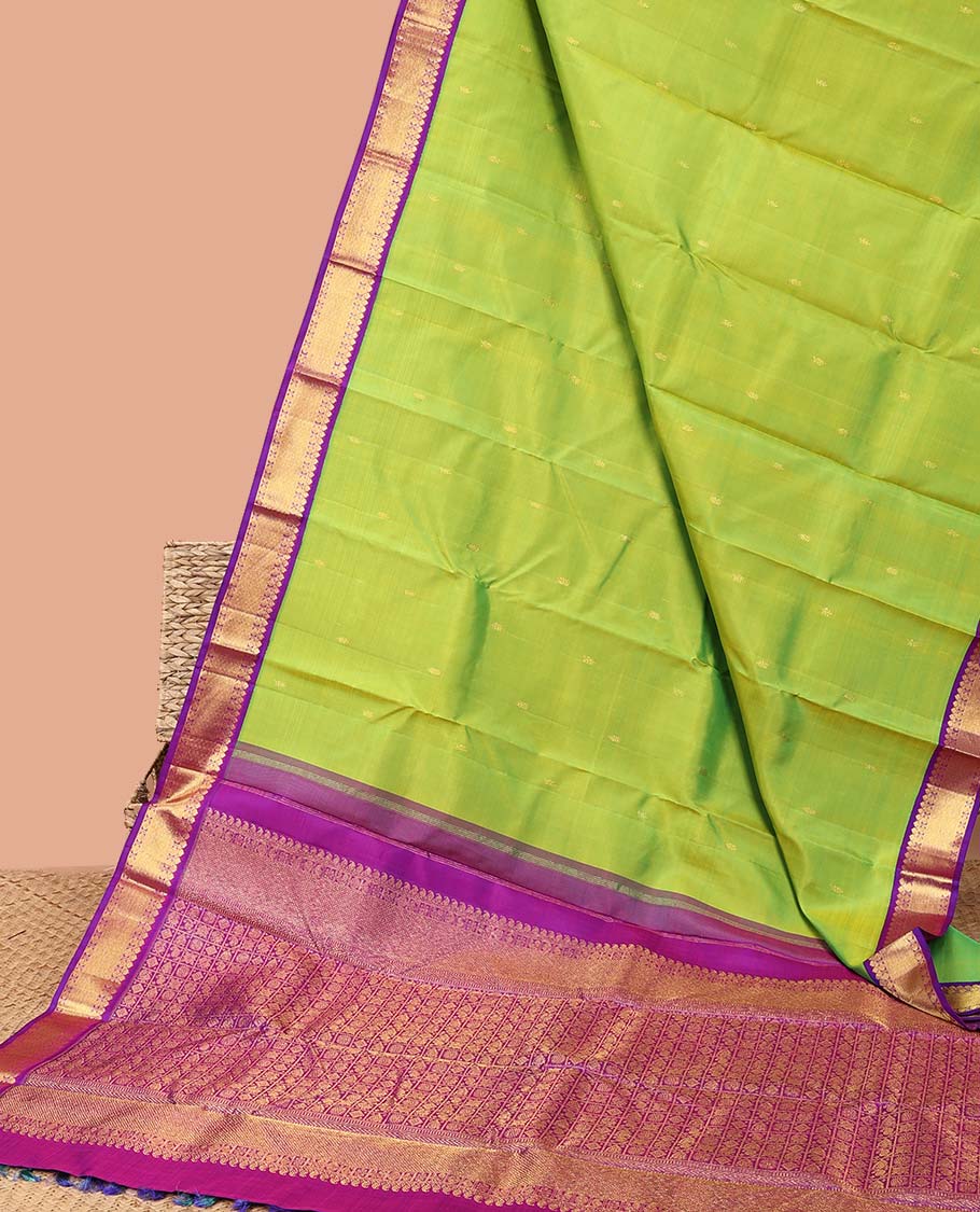 Green leaf buttas kancheepuram silk saree with intricate zari pallu & korvai border of thilakam mokku,paun desigs