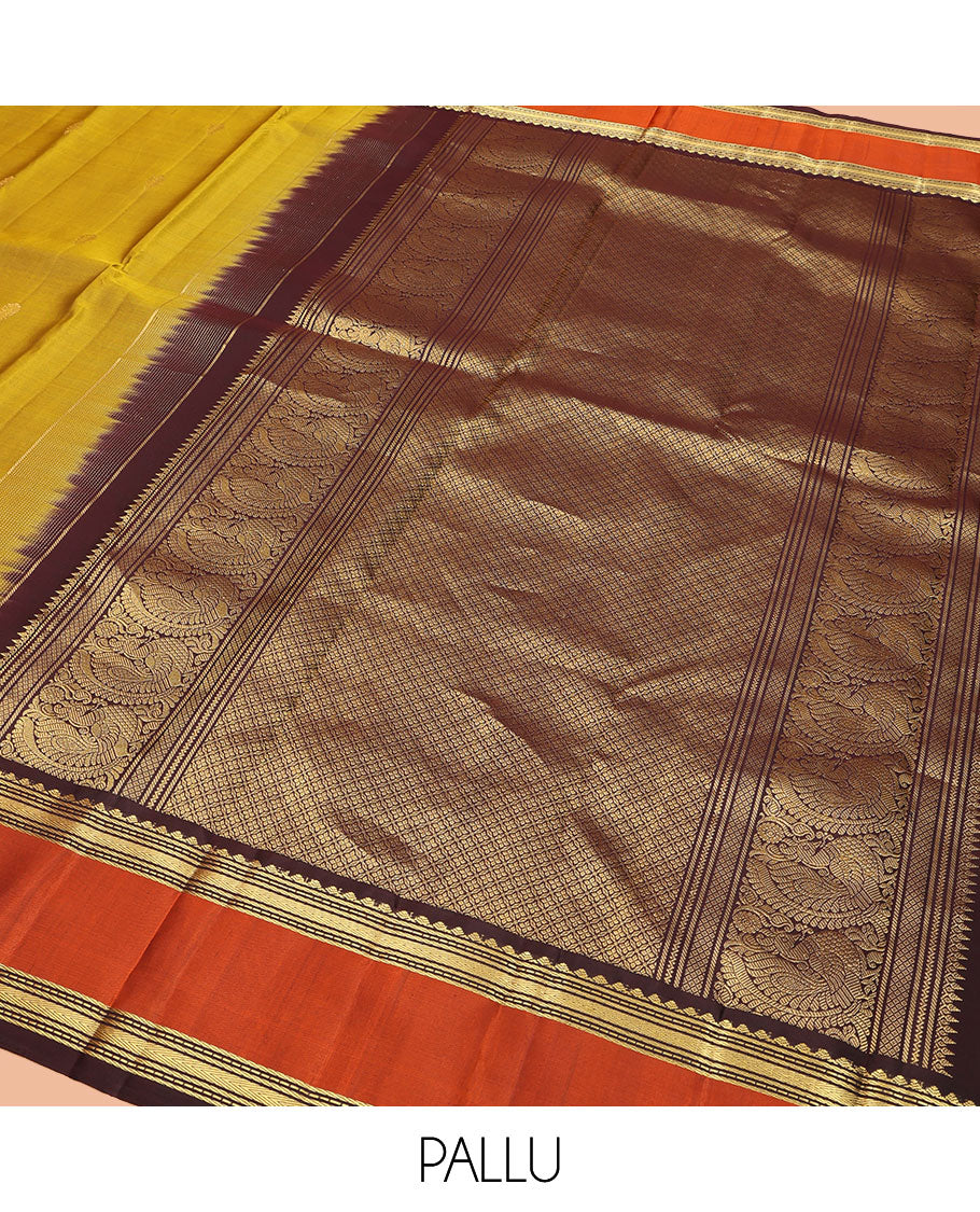 Green Vasundhara Silk Saree, Detailed with Zari Buttas All Over Its Body, Complemented by a Contrast Rettai Pettu Border of Traditional Designs, Grand Jaal Pallu, and Paired with a Contrast Blouse