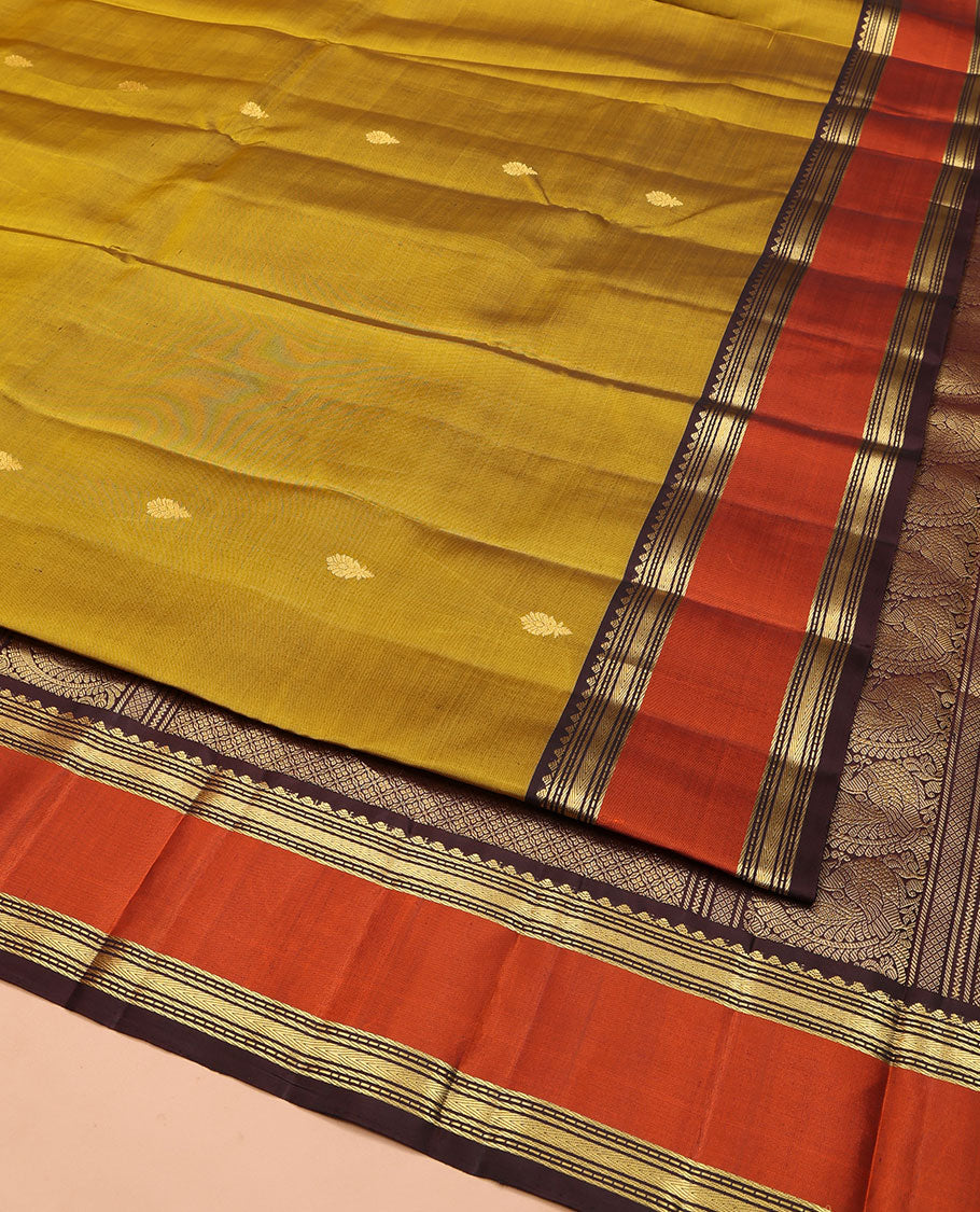 Green Vasundhara Silk Saree, Detailed with Zari Buttas All Over Its Body, Complemented by a Contrast Rettai Pettu Border of Traditional Designs, Grand Jaal Pallu, and Paired with a Contrast Blouse
