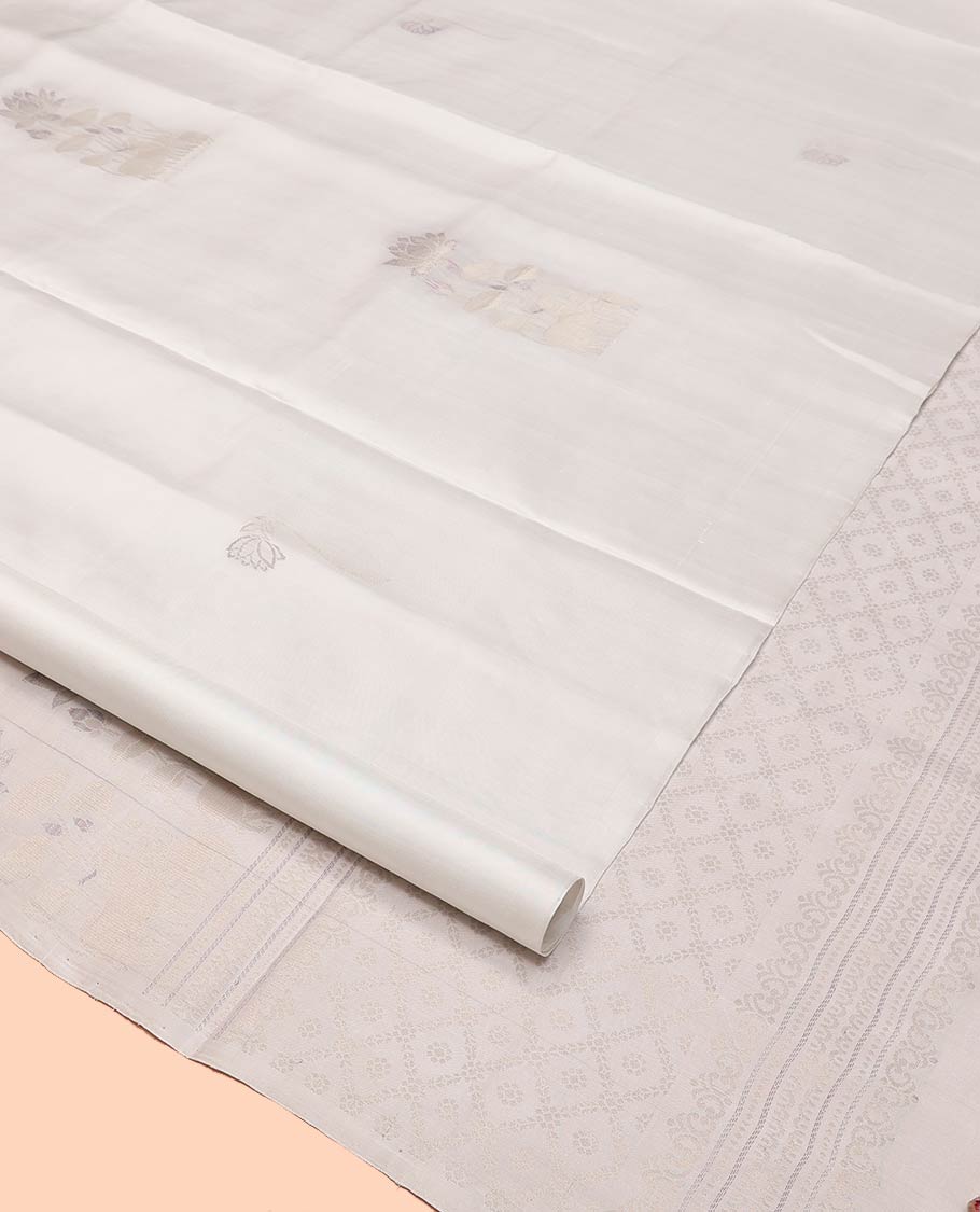 Borderless Cream Mayuri Soft Silk Saree, Sparsely Woven with Pichwai Lotus and Cow Buttas All Over Its Body, Highlighted by Pallu of Pichwai Designs, and Paired with a Matching Blouse