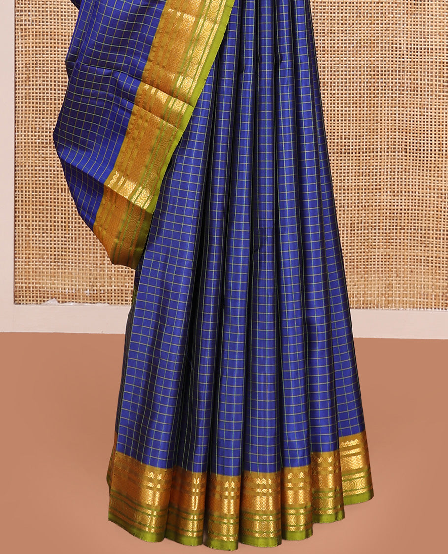 Blue checked Kanchipuram silk saree, contrast border of salngai, kathir, mayil kann, and mayil kann designs, and zari striped pallu