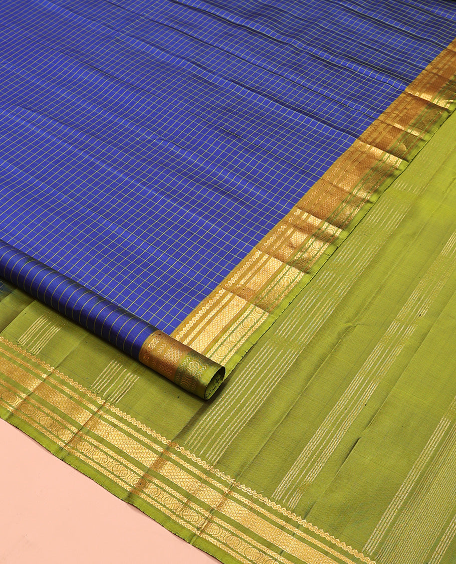 Blue checked Kanchipuram silk saree, contrast border of salngai, kathir, mayil kann, and mayil kann designs, and zari striped pallu