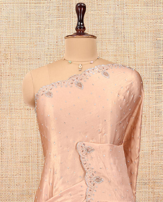 Champagne Designer Saree Gleamed up with Stone Work On Its Body, Scallop Embroidered Border, and Paired with a Heavy Embroidered Matching Blouse