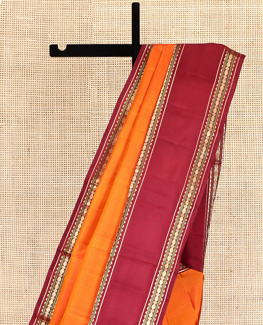 Orange Plain Kanchipuram Silk Saree, Complemented by a Contrast Rettai Pettu Border of Rekku, Muthu, and Poun Designs, Seppu Rekku Pallu, and a Contrast Blouse