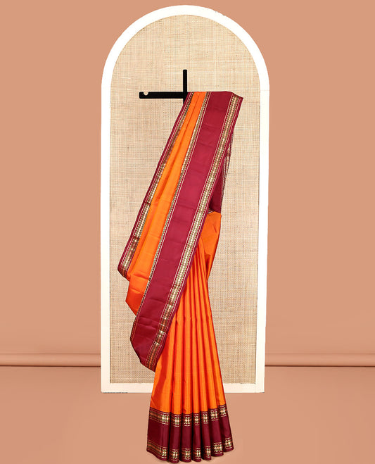 Orange Plain Kanchipuram Silk Saree, Complemented by a Contrast Rettai Pettu Border of Rekku, Muthu, and Poun Designs, Seppu Rekku Pallu, and a Contrast Blouse