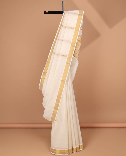 Cream kerala saree with zari designs, zari border & pallu of intricate designs in zari