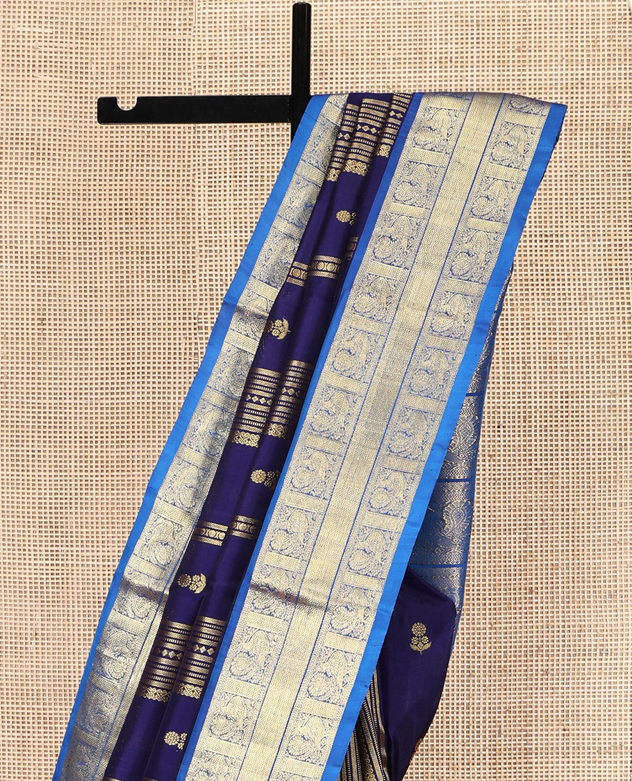 Navy Blue Venkatagiri Silk Saree, Detailed with Zari Designs All Over Its Body, Complemented by a Contrast Traditional Zari Border of Peacock Designs, Pallu of Peacock Designs, and Paired with a Contrast Blouse