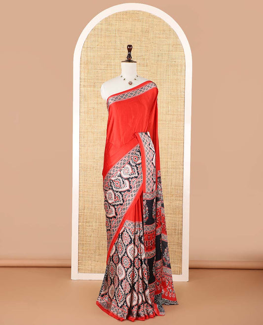 Red half-&-half style modal satin saree features floral & geometric design Ajrakh printed contrast border & pallu