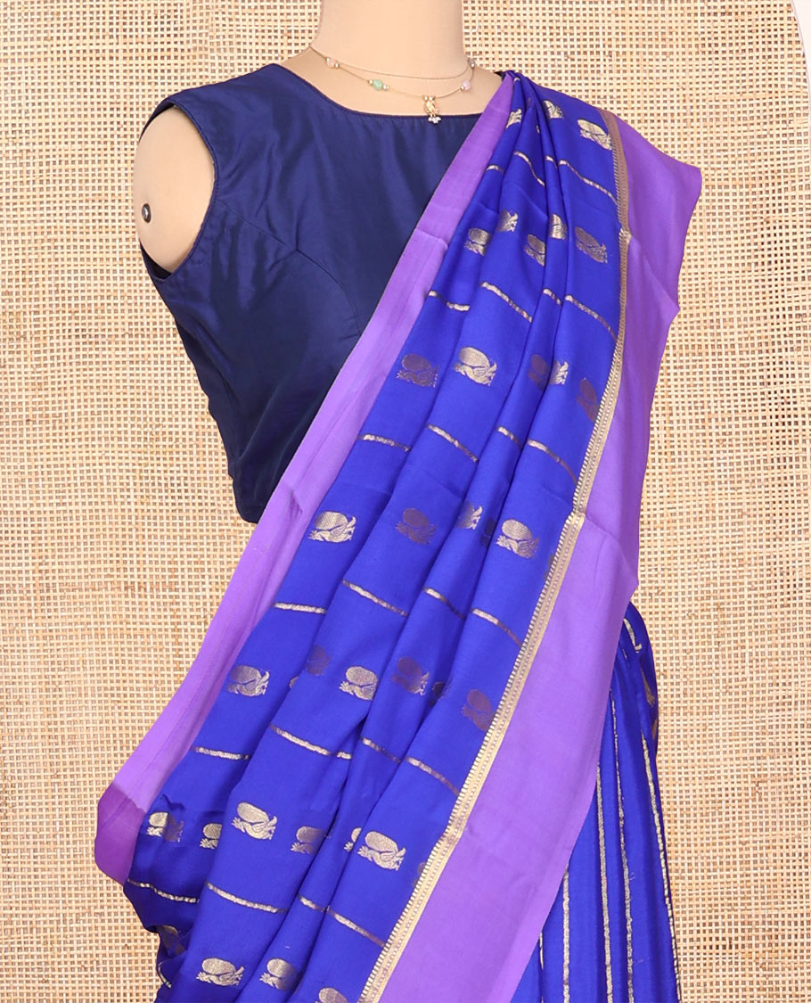 Blue Mysore Silk Saree, Gracefully Decked Up with Peacock Buttas and Stripes Across Its Body, Complemented by Contrast Border, Pallu Steeped with Traditional Zari Designs, and Paired with a Contrast Blouse