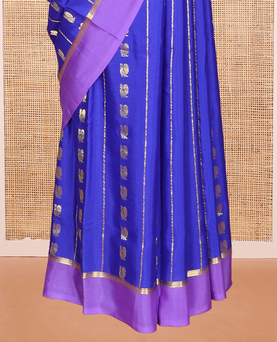 Blue Mysore Silk Saree, Gracefully Decked Up with Peacock Buttas and Stripes Across Its Body, Complemented by Contrast Border, Pallu Steeped with Traditional Zari Designs, and Paired with a Contrast Blouse