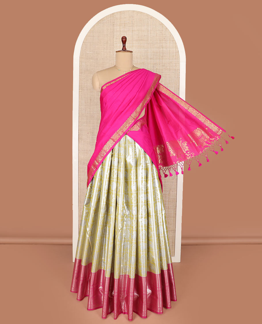 Yellow butta enclosed checked art silk half-saree, contrast traditional zari bordered skirt, contrast jacquard blouse and a contrast floral design dhavani