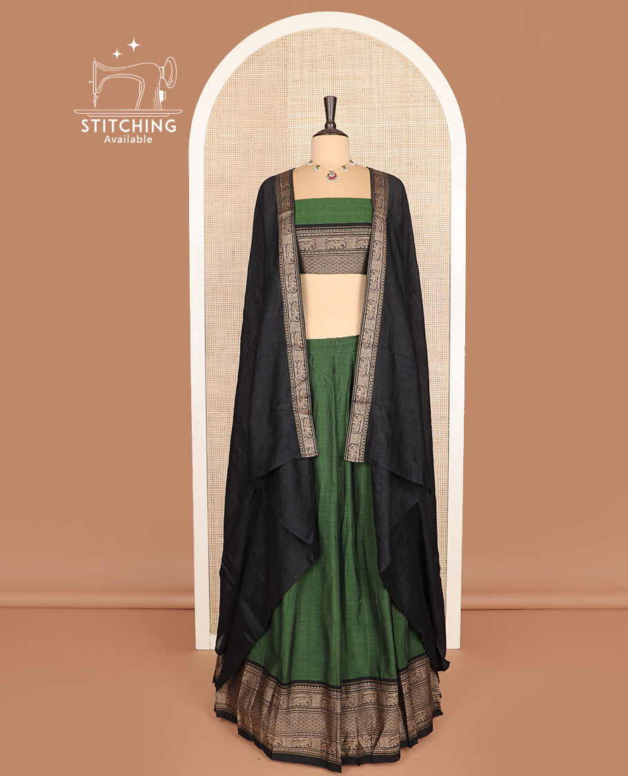Green cotton half-saree, plain with contrast traditional motifs woven bordered skirt, matching blouse, and a contrast bordered dhavani