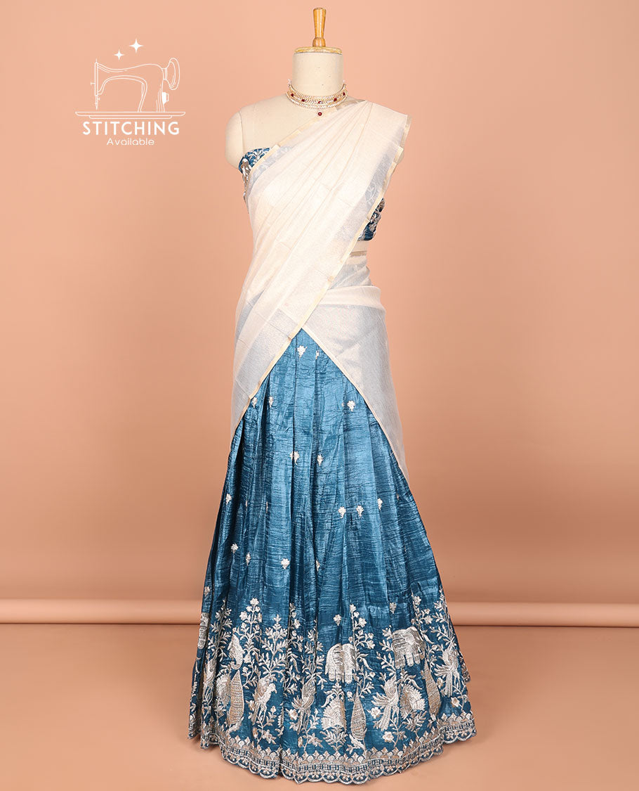 Blue floral, elephant embroidered half saree with self embroidered border, floral embroidery blouse & floral buttas , scallop border dhavani