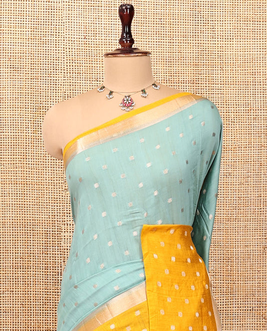 Pale Blue Assam Silk Saree, Steeped with Zari Buttas, Complemented by Contrast Zari Buttas Woven Border, Gleaming Pallu, and Contrast Blouse