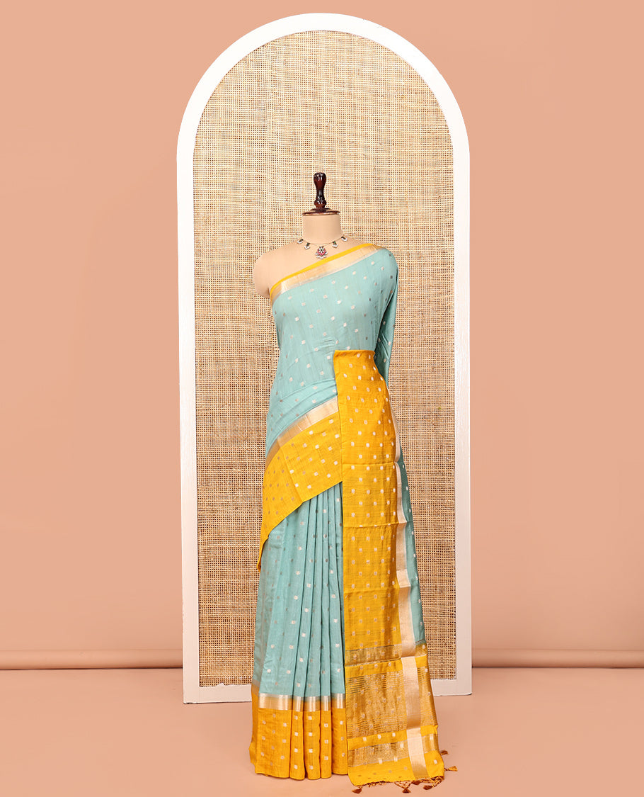 Pale Blue Assam Silk Saree, Steeped with Zari Buttas, Complemented by Contrast Zari Buttas Woven Border, Gleaming Pallu, and Contrast Blouse