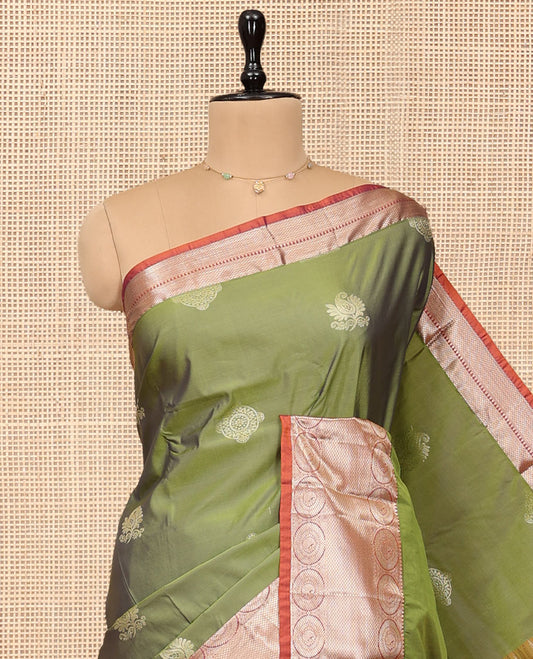 Green Budget Silk Saree, Bedecked with Zari Buttas, Complemented by a Contrast Traditional Chakram Zari Border, Jaal Pallu, and Contrast Blouse