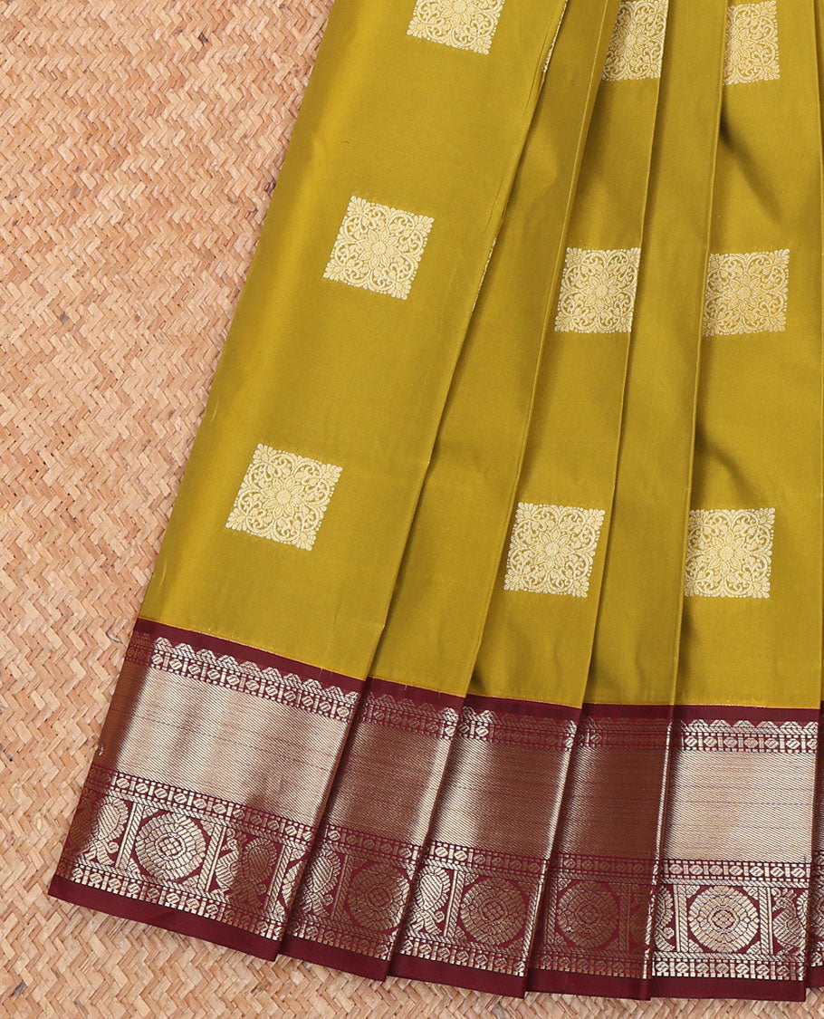 Green Budget Silk Saree, Detailed with Zari Buttas All Over Its Body, Complemented by a Contrast Traditional Zari Design Border of Peacock-Chakram Designs, Subtle Jaal Pallu, and Paired with a Contrast Blouse