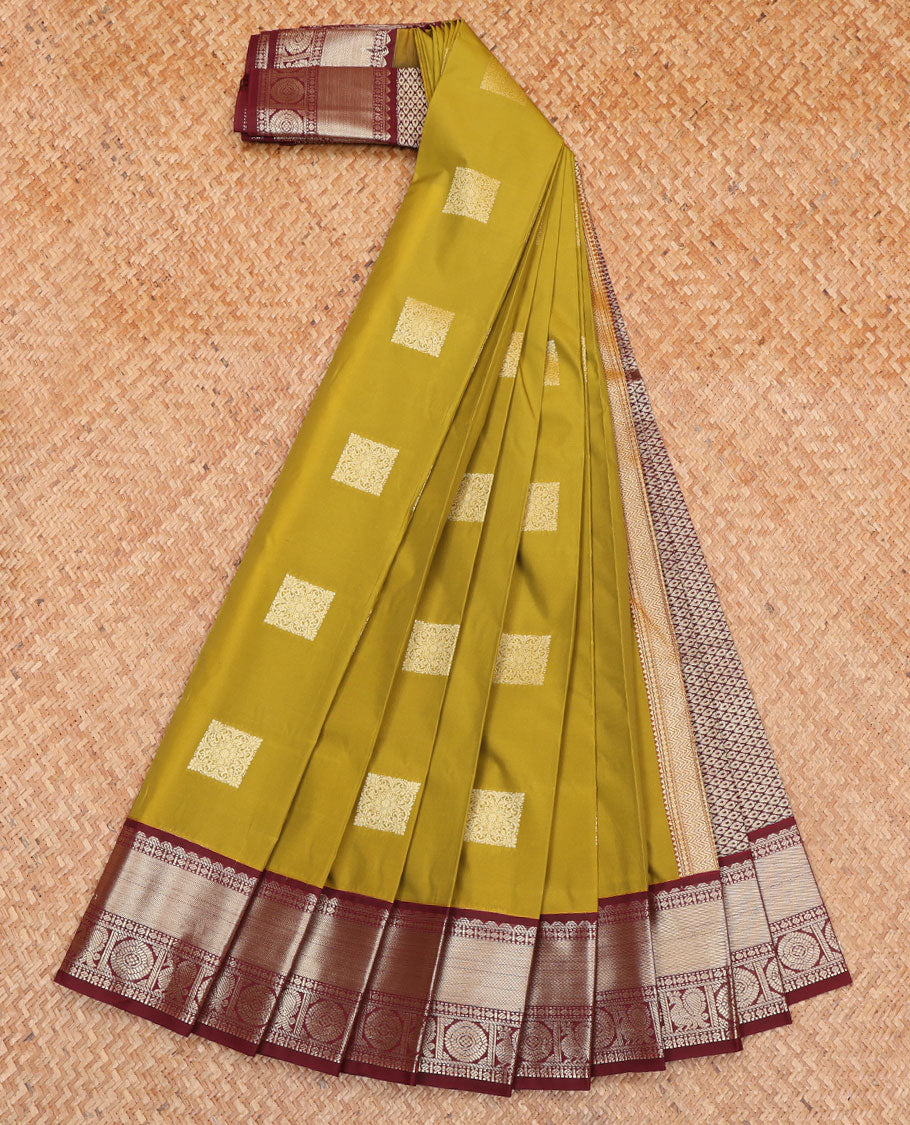 Green Budget Silk Saree, Detailed with Zari Buttas All Over Its Body, Complemented by a Contrast Traditional Zari Design Border of Peacock-Chakram Designs, Subtle Jaal Pallu, and Paired with a Contrast Blouse