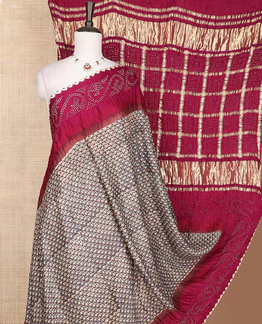 Beige scallop printed bandhani silk saree, contrast bandhani dotted border, and dots enclosed thick zari checked pallu