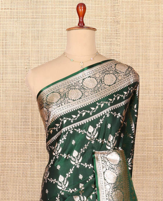 Green Semi-Banaras Saree, Beautifully Bedecked with Jaal Jacquard on Its Body, Highlighted by a Floral Creeper Design Border, Intricately Designed Pallu, and Paired with a Matching Blouse