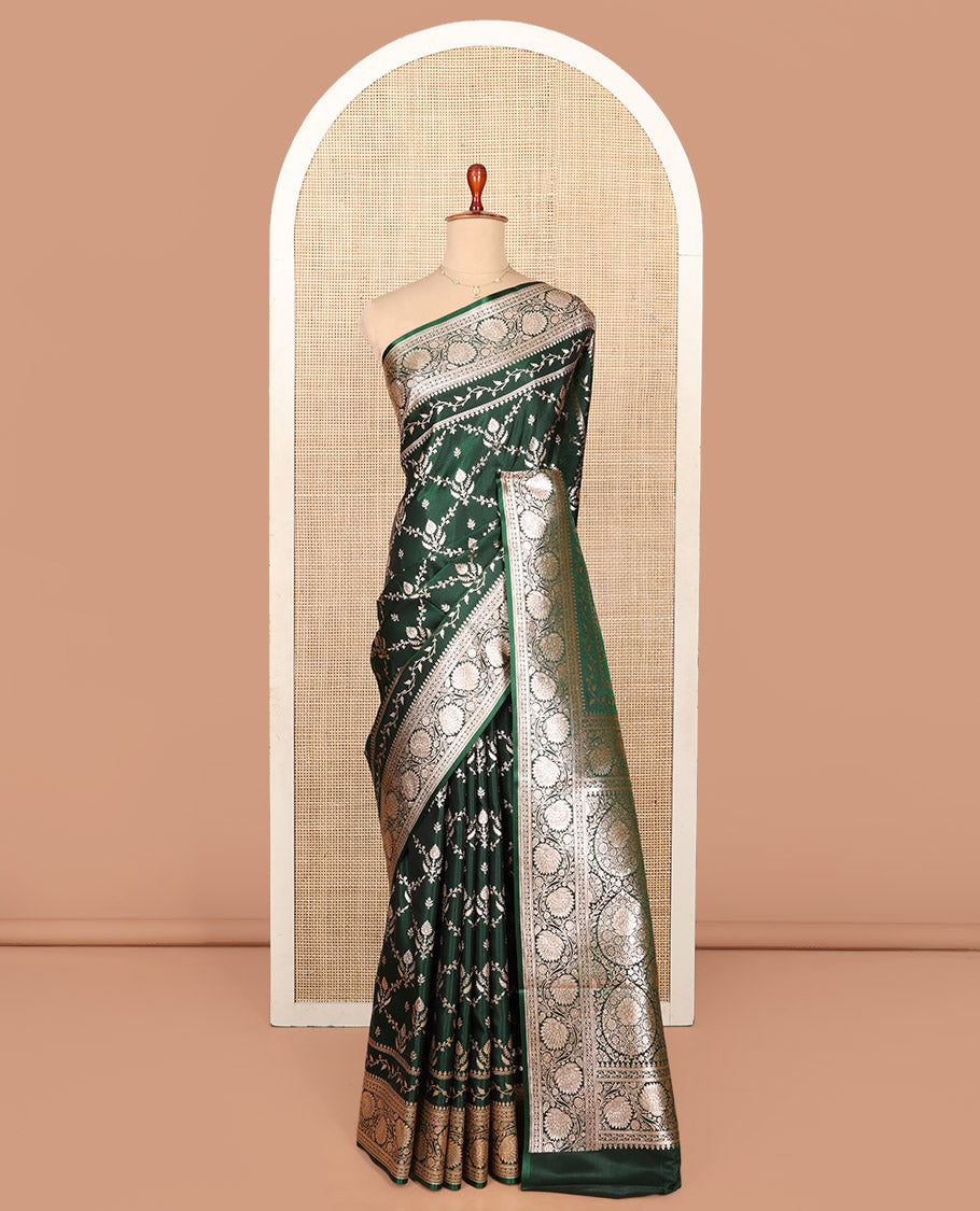 Green Semi-Banaras Saree, Beautifully Bedecked with Jaal Jacquard on Its Body, Highlighted by a Floral Creeper Design Border, Intricately Designed Pallu, and Paired with a Matching Blouse