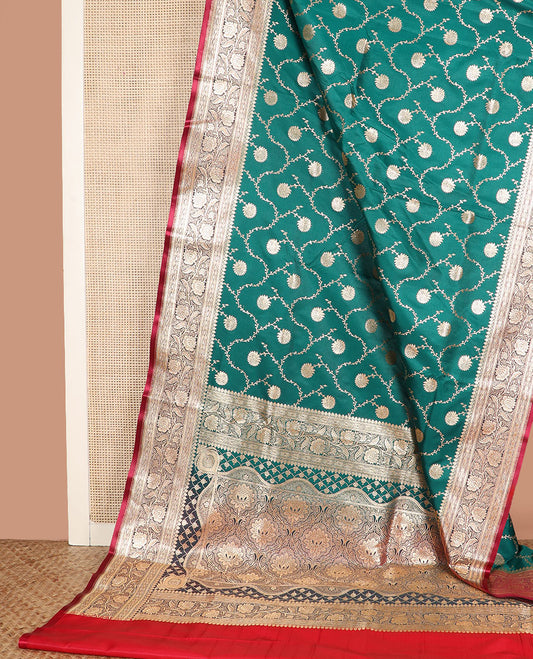 Green floral jaal jacquard banarasi silk saree, contrast floral creeper design border, and intricate ogee patterned pallu