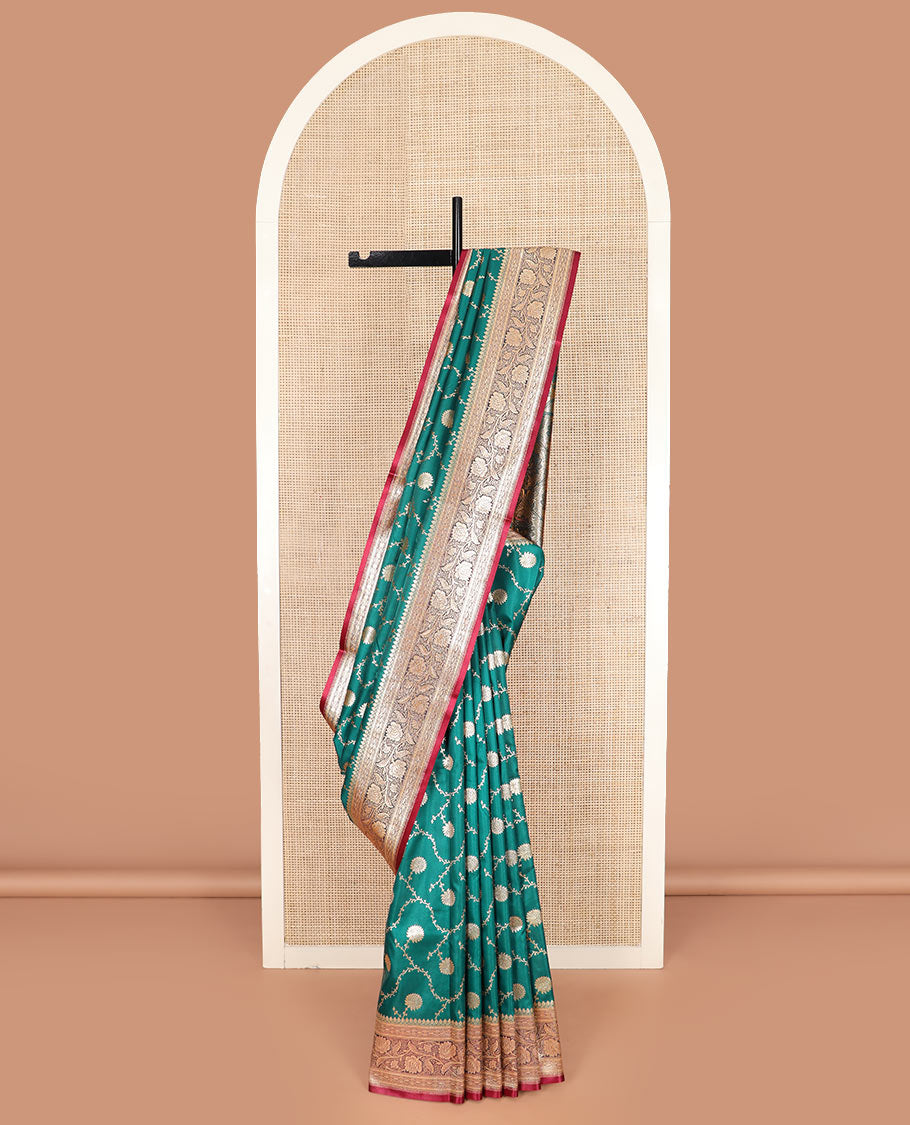 Green floral jaal jacquard banarasi silk saree, contrast floral creeper design border, and intricate ogee patterned pallu