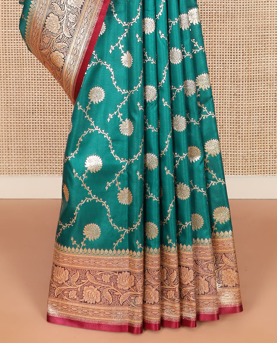 Green floral jaal jacquard banarasi silk saree, contrast floral creeper design border, and intricate ogee patterned pallu