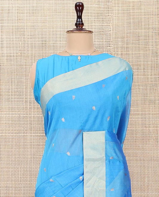 Blue Chanderi Cotton Saree, Subtly Sparkled with Buttas All Over Its Body, Subtly Woven Bavanji Border, Complemented by a Contrast Pallu Steeped with Floral Designs, and Paired with a Contrast Blouse