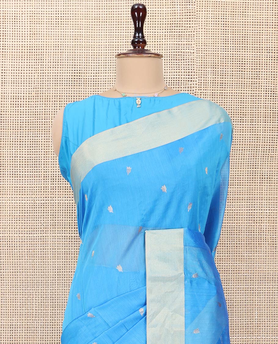 Blue Chanderi Cotton Saree, Subtly Sparkled with Buttas All Over Its Body, Subtly Woven Bavanji Border, Complemented by a Contrast Pallu Steeped with Floral Designs, and Paired with a Contrast Blouse
