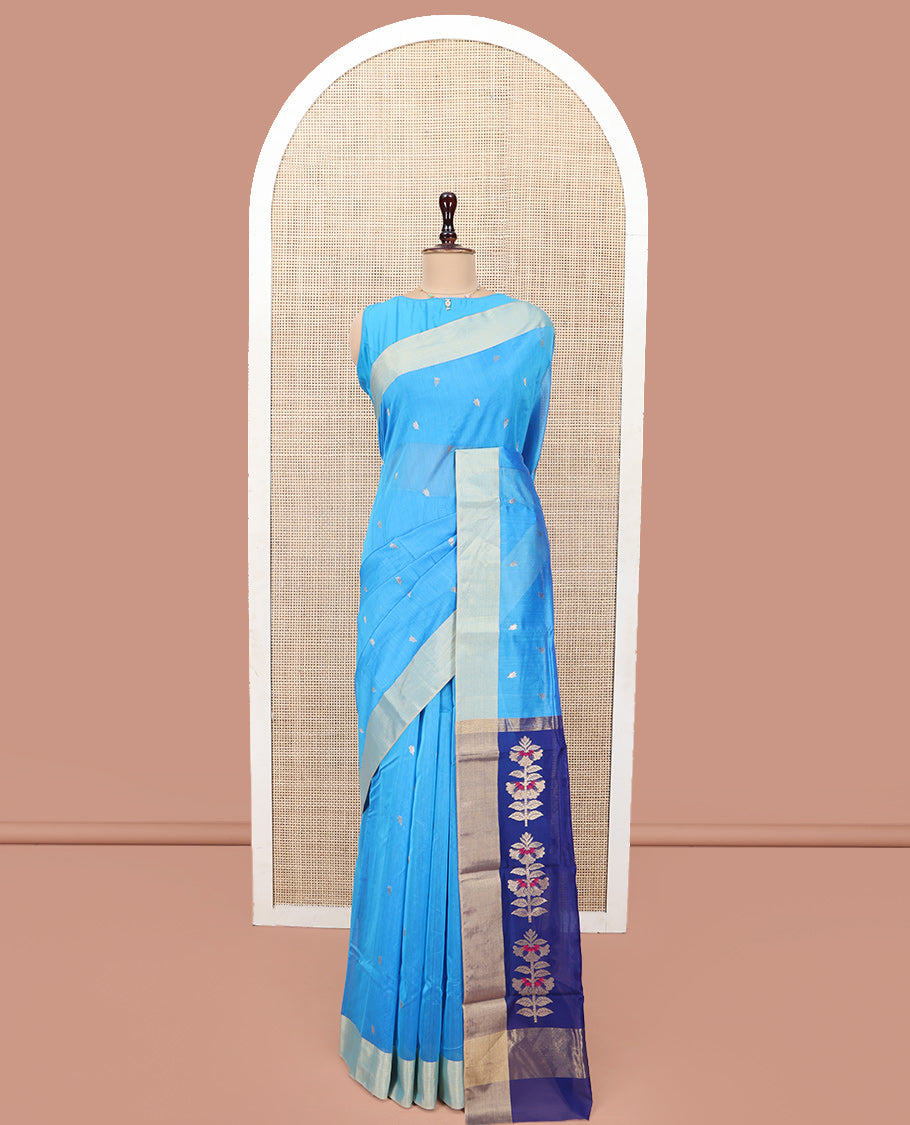 Blue Chanderi Cotton Saree, Subtly Sparkled with Buttas All Over Its Body, Subtly Woven Bavanji Border, Complemented by a Contrast Pallu Steeped with Floral Designs, and Paired with a Contrast Blouse