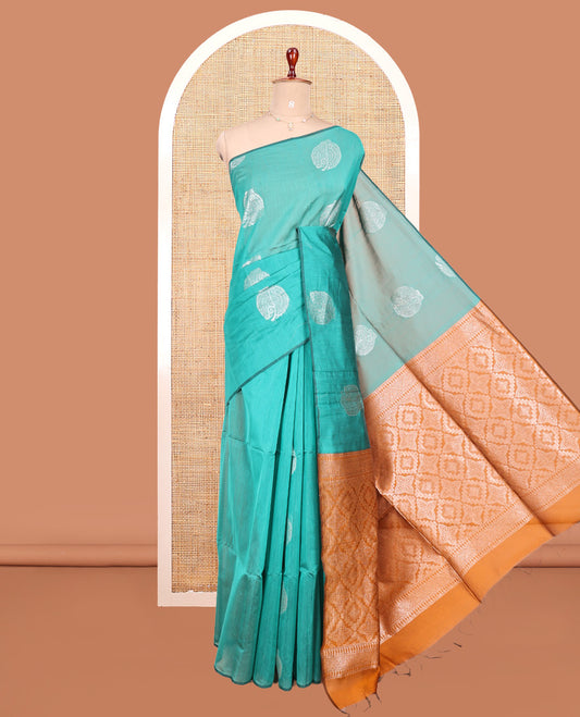 Borderless Green Semi-Silk Cotton Saree, Beautified with Zari Buttas All Over Its Body, Complemented by Contrast Jaal Patterned Pallu, and Paired with a Contrast Blouse