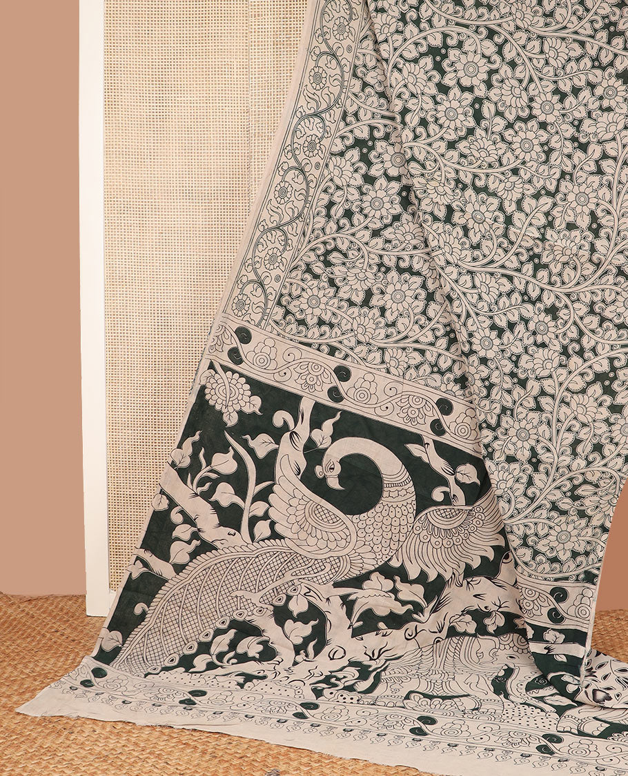 Deep green floral vine machine-printed kalamkari cotton saree, floral creeper printed border, and pallu of animal motifs print