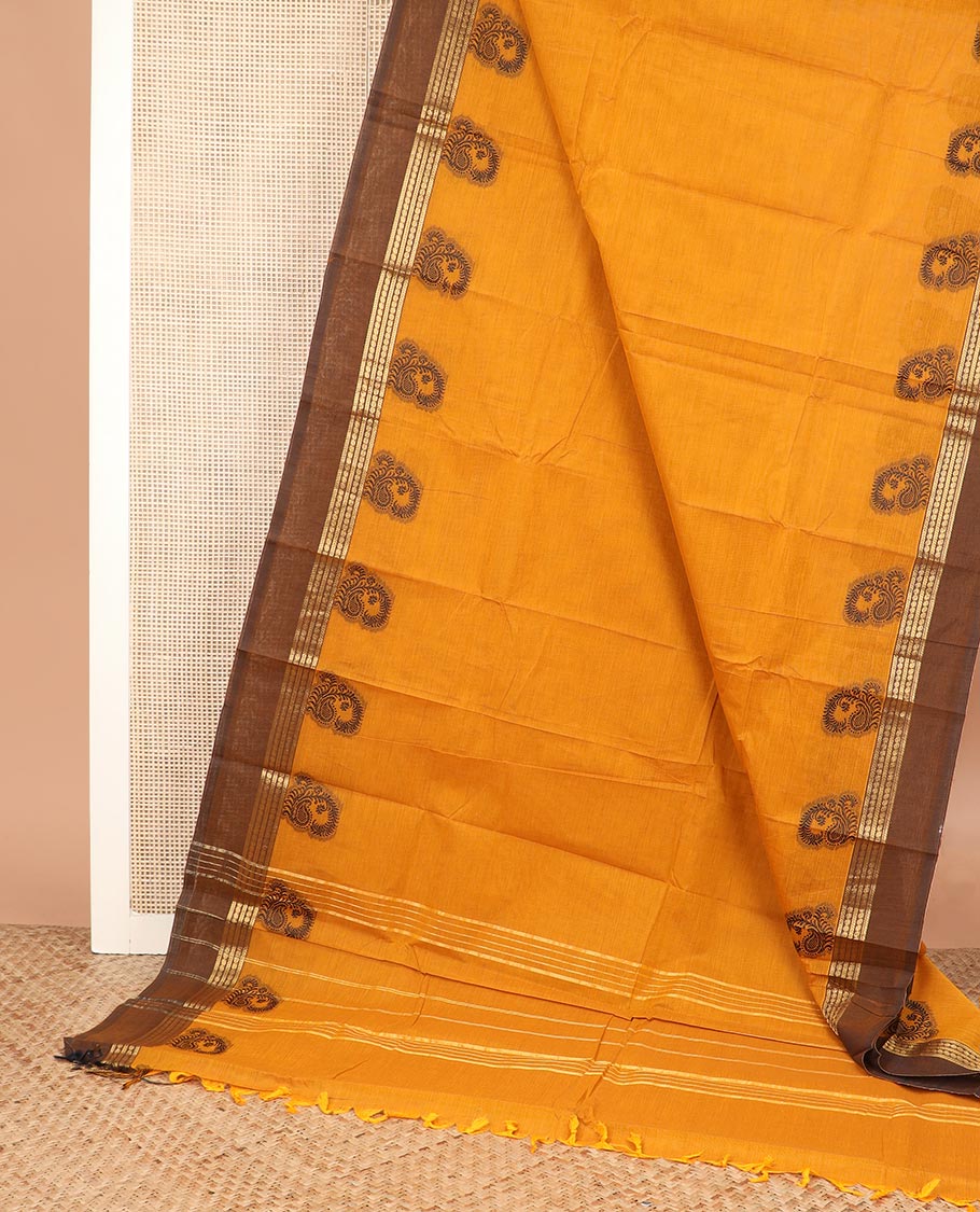 Yellow plain Chettinad cotton saree, contrast traditional zari border, and zari striped pallu