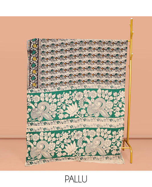 Multi-Color Machine-Printed Kalamkari Cotton Saree, Decked Up with Batik Vines on Its Body, Complemented  by a Contrast Border of Batik Paisley Print, Pallu of Floral-Peacock Print, and Paired with a Printed Blouse