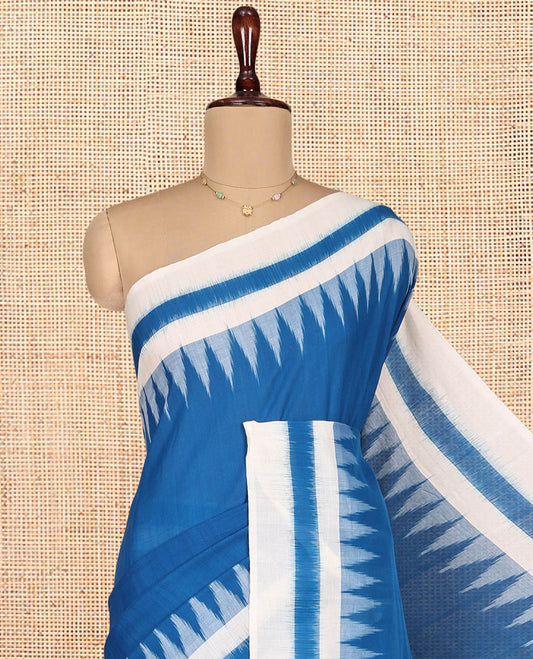 Blue Plain Ikkat Cotton Saree, Complemented by a Contrast Ikkat Temple Border, Pallu Steeped with Buttas, and Paired with a Contrast Blouse