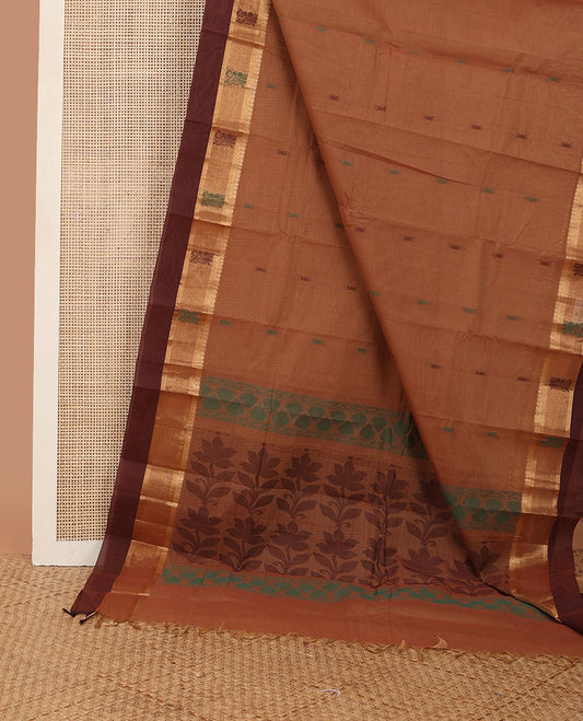 Brown unique buttas kanchi cotton saree, contrast border of zari & thread motifs, & pallu of floral designs