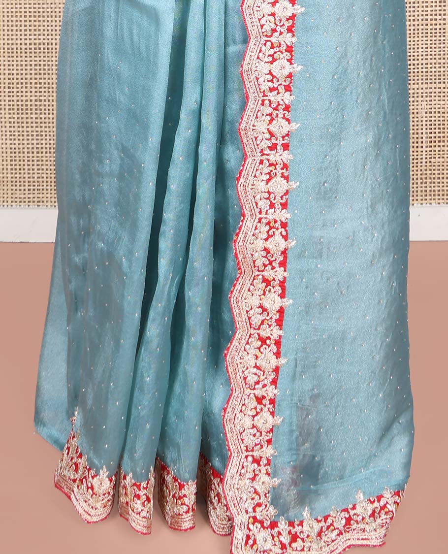 Blue Designer Saree, Gleamed with Stone Work Across Its Body, Complemented by a Contrast Scallop Patch-Embroidered Border, a Self Pallu, and Paired with Matching Blouse Featuring Embroidery and Bandhani Dots