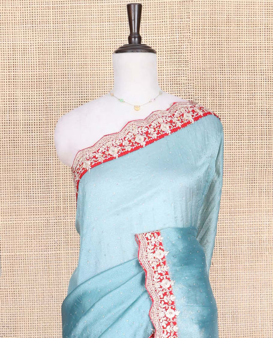 Blue Designer Saree, Gleamed with Stone Work Across Its Body, Complemented by a Contrast Scallop Patch-Embroidered Border, a Self Pallu, and Paired with Matching Blouse Featuring Embroidery and Bandhani Dots